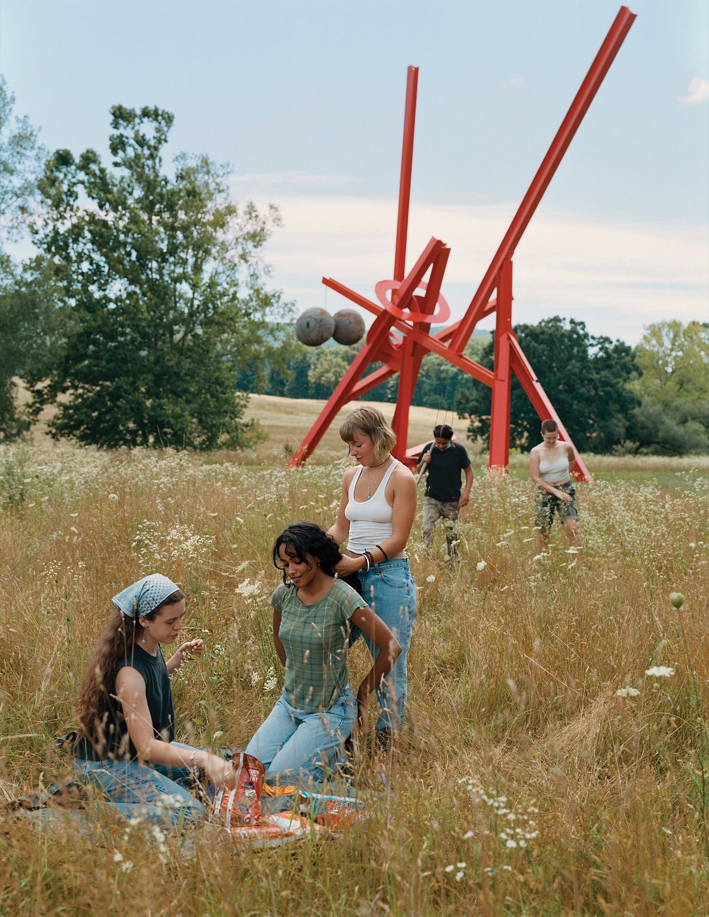 People outside sculpture.