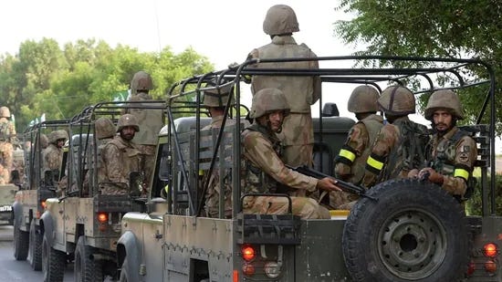 A group of soldiers on a military vehicle

Description automatically generated with low confidence