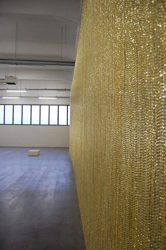 View of “Felix Gonzalez-Torres,” 2010. From left: “Untitled” (Passport), 1991; “Untitled” (Golden), 1995. 