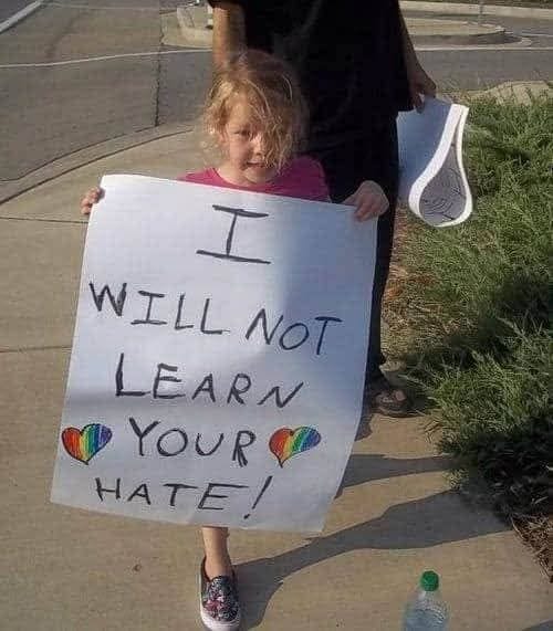 May be an image of 1 person and text that says 'I WILL NOT LEARN ጣ YOUR HATE! HA'