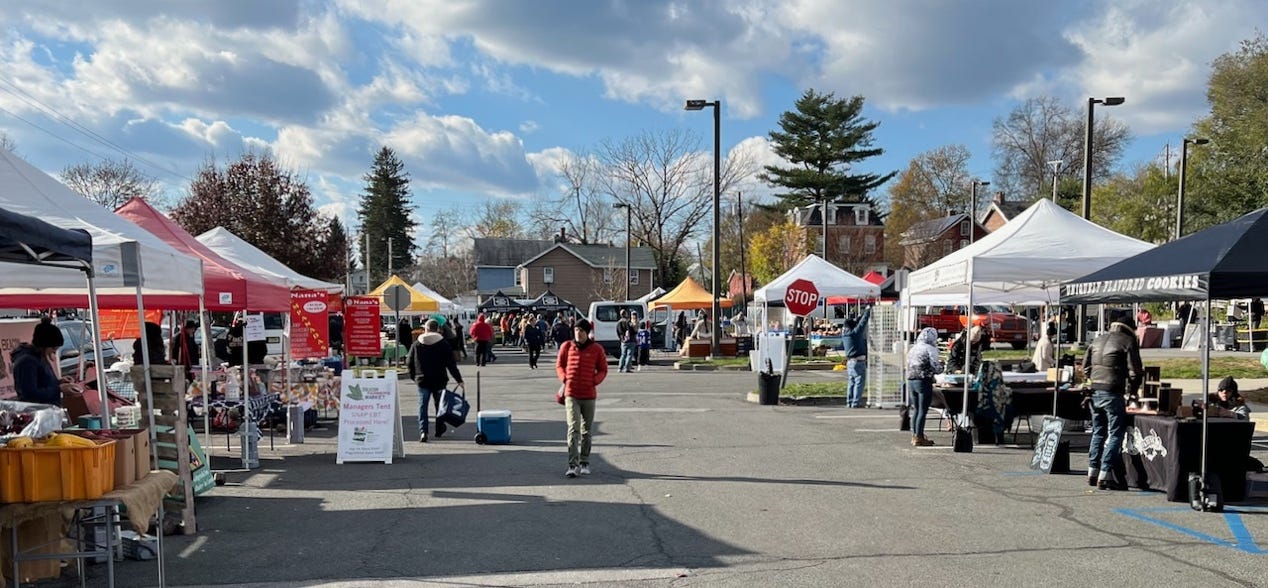 A group of people at an outdoor market

Description automatically generated with medium confidence