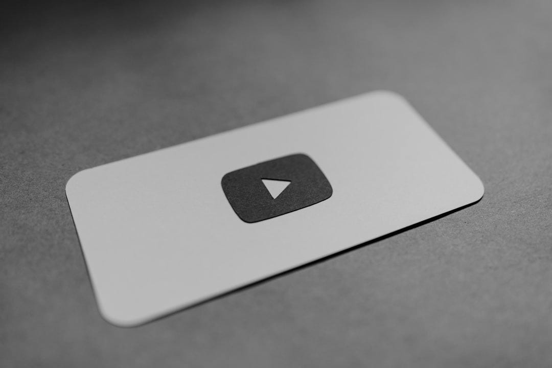 a red and white play button on a white card a red and white play button on a white card