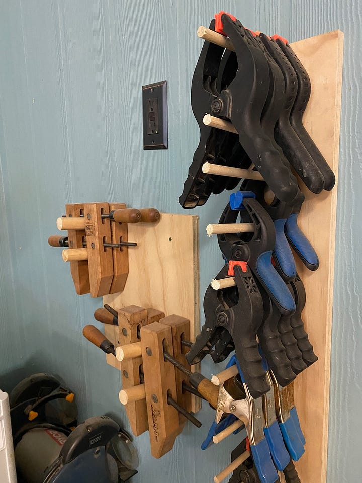 Wall-mounted clamp racks.