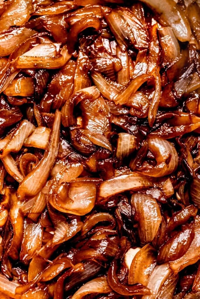 Extreme close up of caramelized sauteed onions. Extreme close up of caramelized sauteed onions.