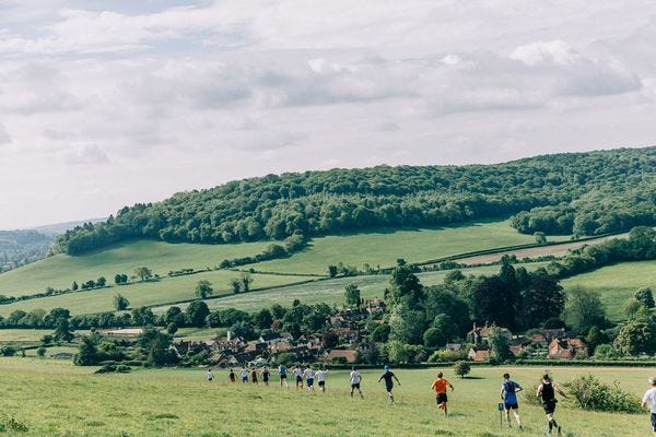 The first descent into a village and straight up the hill behind it