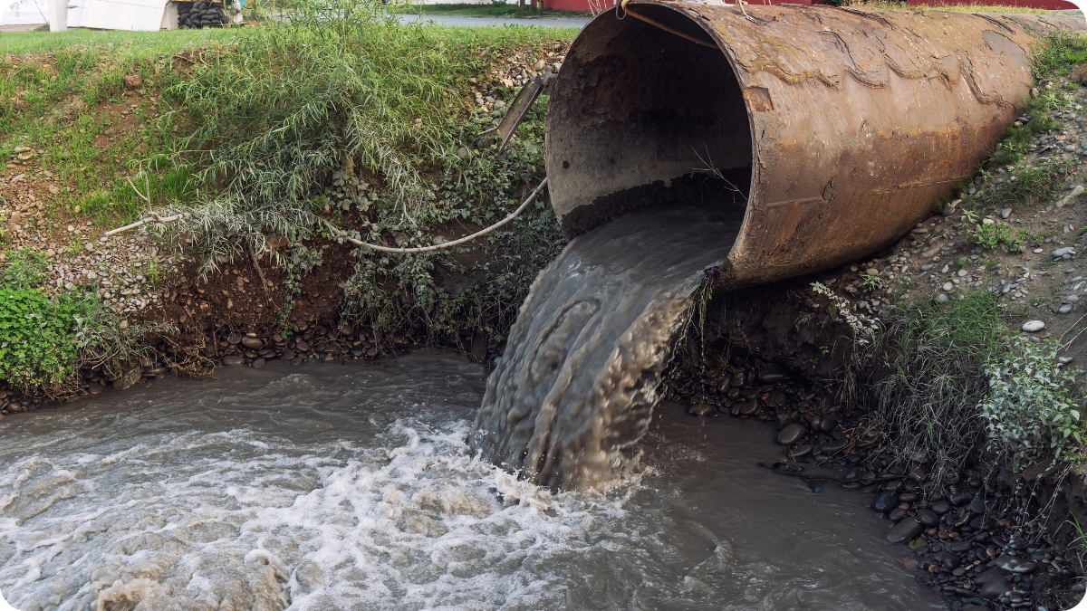 Dirty water runoff from pipe into stream