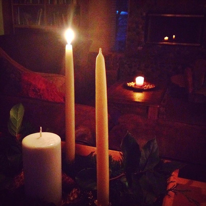 First candle lit on the Advent Sun Wheel, 2017. Photo by JPC.