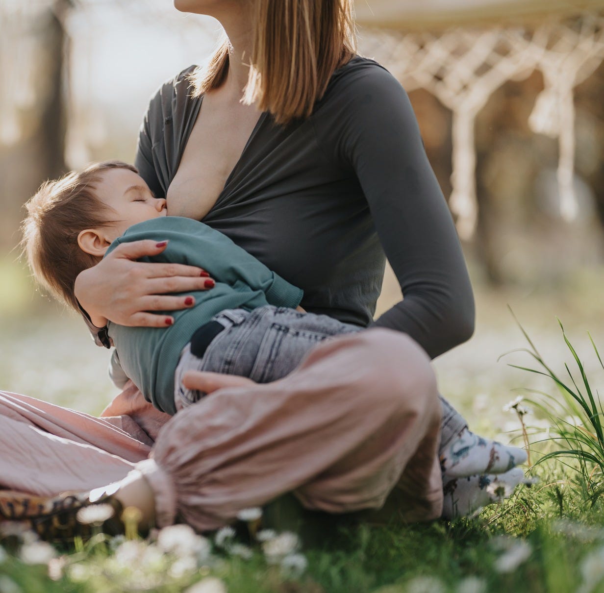 mom nursing a toddler 