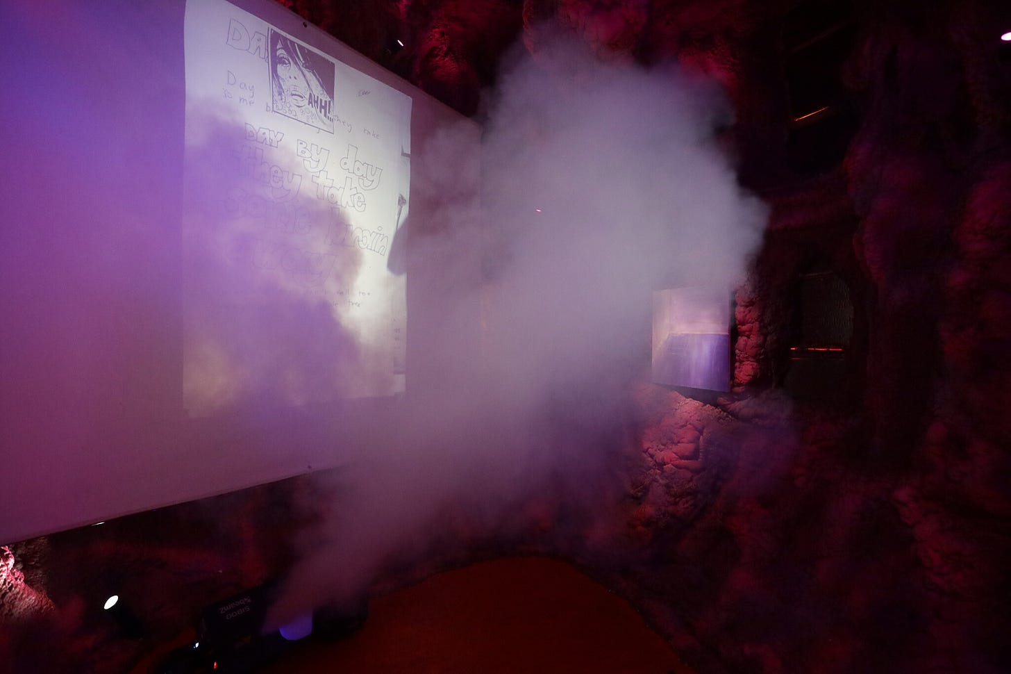 <p>Evie Poggioli, <em>Like Wading Through Honey, </em>2025, 35mm Slide Film (Psych Ward Drawings, Found Images), Projection Reel, Fog machine, 17 Minute Spoken Word Audio, Suicidal Oil Piglet: The Womb. Photo: Joseph Doggett-Williams</p>