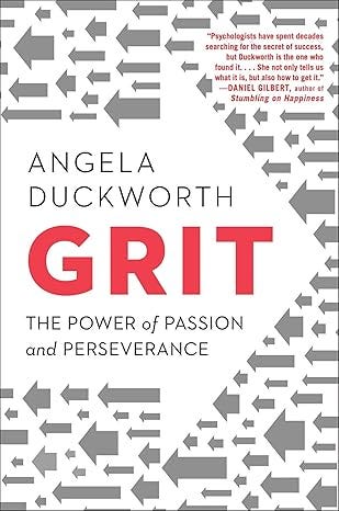 Book cover for Grit by Angela Duckworth, featuring bold red title text surrounded by gray arrows and the subtitle “The Power of Passion and Perseverance.”