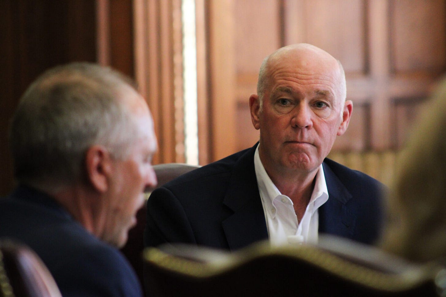 Gov. Greg Gianforte listens to Sen. Greg Hertz, R-Polson, outline his subcommittee's proposals out of the Property Tax Task Force at a meeting on Aug. 15, 2024. (Photo by Blair Miller, Daily Montanan) Gov. Greg Gianforte listens to Sen. Greg Hertz, R-Polson, outline his subcommittee's proposals out of the Property Tax Task Force at a meeting on Aug. 15, 2024. (Photo by Blair Miller, Daily Montanan)