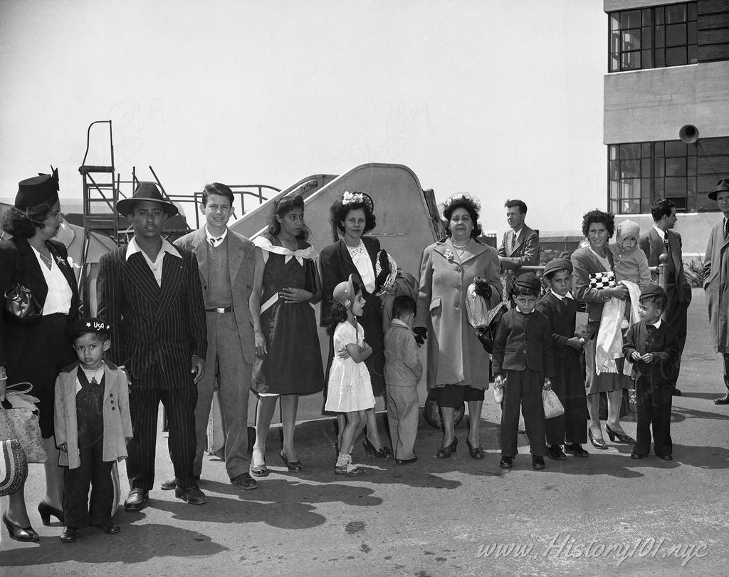 Photograph shows a group of Puerto Ricans, at Newark airport, who just arrived by plane from Puerto Rico waiting to be transported to New York. Photograph shows a group of Puerto Ricans, at Newark airport, who just arrived by plane from Puerto Rico waiting to be transported to New York.