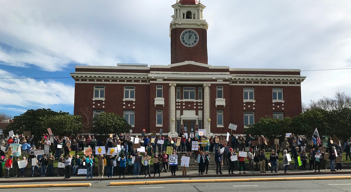 May be an image of 2 people, crowd and text