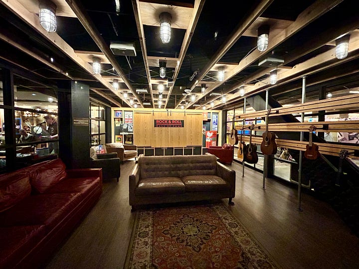guitars, instruments, couch, lights, floor, door