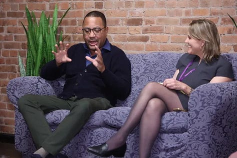 Meghan Daum hosting an Unspeakeasy retreat weekend in New York City with attendees in conversation around a table