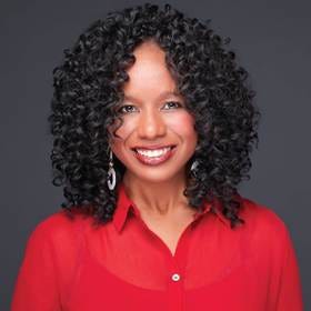 A person with curly hair wearing a red shirt

AI-generated content may be incorrect.