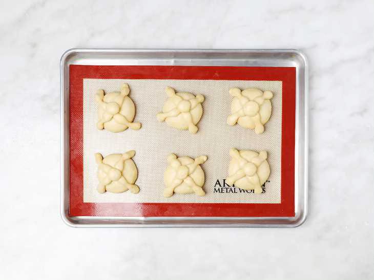 Loaves of Pan de Muerto on Baking Sheet Ready to Bake