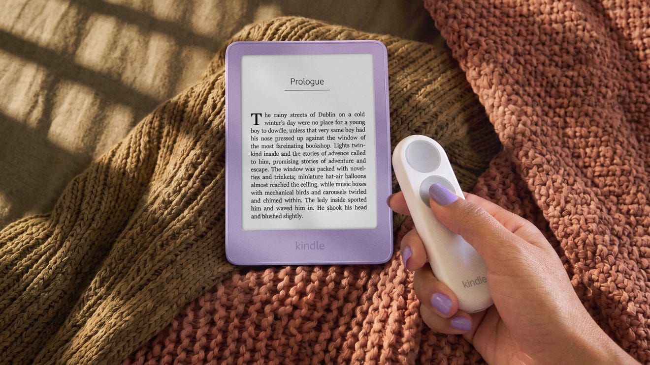 Amazon Kindle e-reader shown with a handheld wireless page-turn remote, allowing readers to turn pages without touching the screen. Amazon Kindle e-reader shown with a handheld wireless page-turn remote, allowing readers to turn pages without touching the screen.