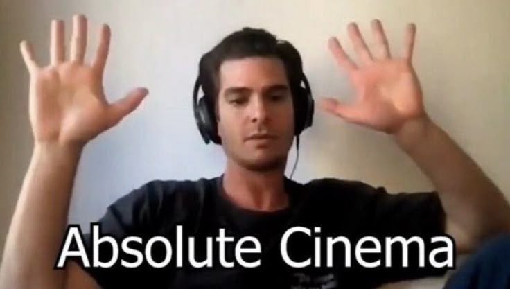 This may contain: a man with headphones on sitting in front of a white wall and holding his hands up