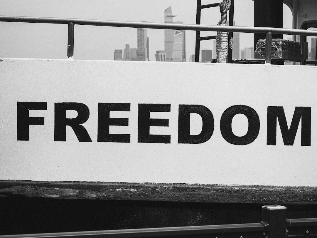 The word "freedom" is seen on a boat.