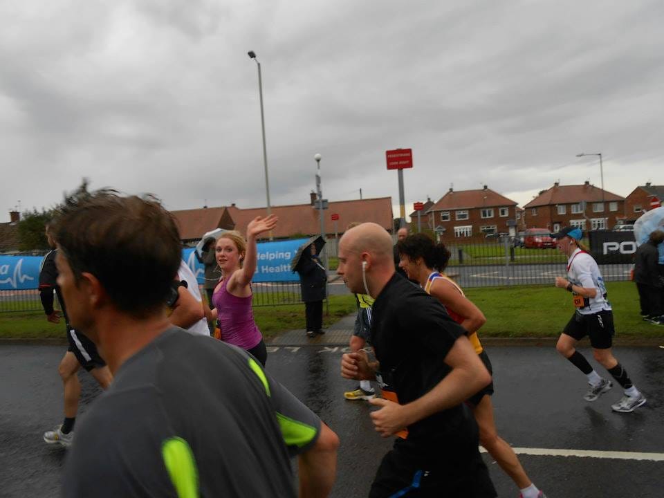 Waving to my mum around the 8-mile marker. I seriously hope that's rain on my back, as opposed to sweat.