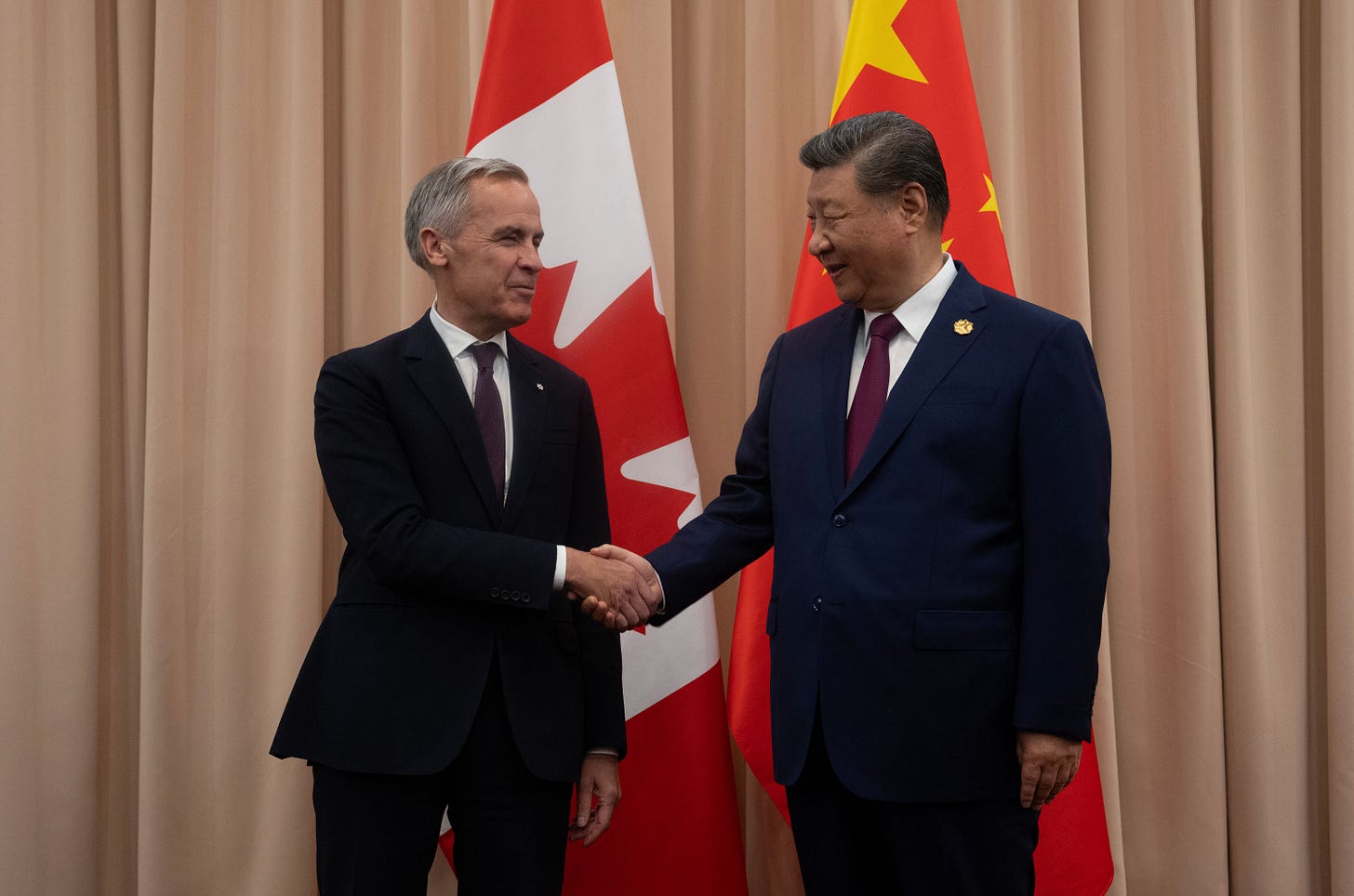 Canadian Prime Minister Mark Carney (L) with Chinese President Xi Jinping in Gyeongju, South Korea, October 31, 2025.