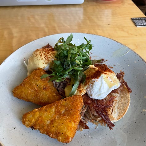eggs benedict, cadbury easter egg, stack of pancakes, sushi roll, tofu and rice dish, homemade nachos, banana bread and coffee, coffee, treats from a bakery