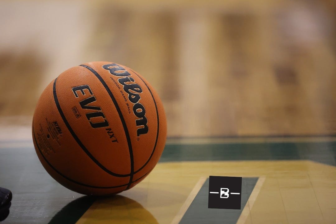 a close up of a basketball on a basketball court