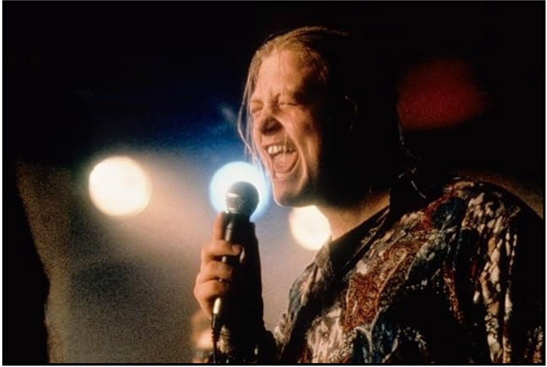 Deco sings a song with all of his heart in a scene from the movie, "The Commitments."