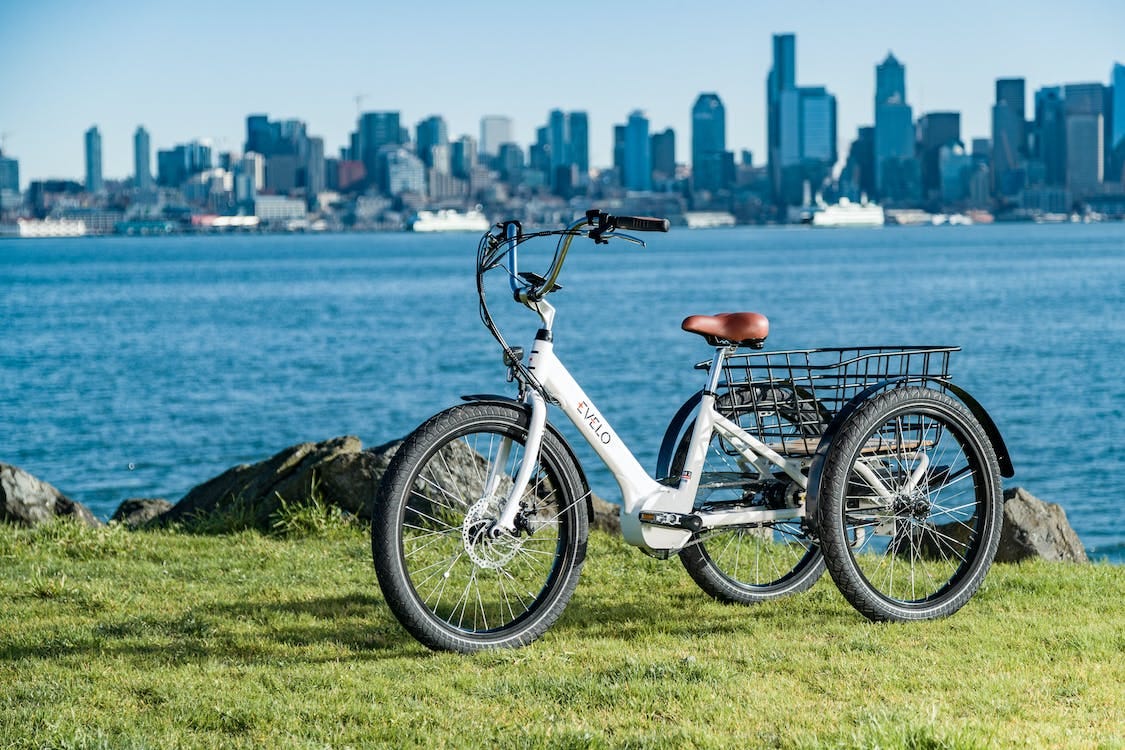 Free Electric Bike Parked Beside the Sea Stock Photo Free Electric Bike Parked Beside the Sea Stock Photo