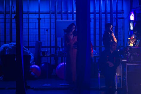 images of burlesque performers on stage with artistic lighting