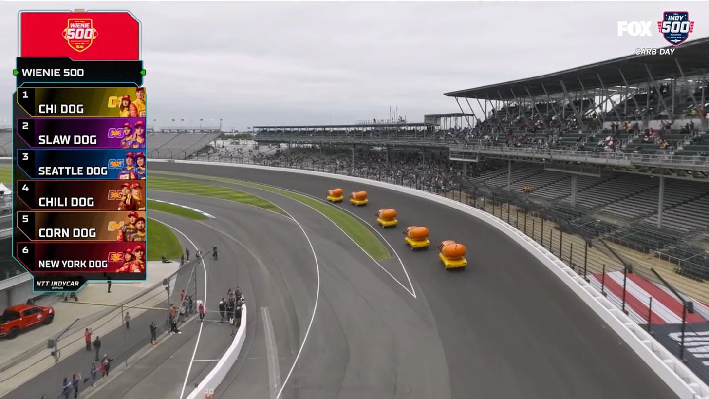 Wienermobiles driving around the Indy 500 track Wienermobiles driving around the Indy 500 track