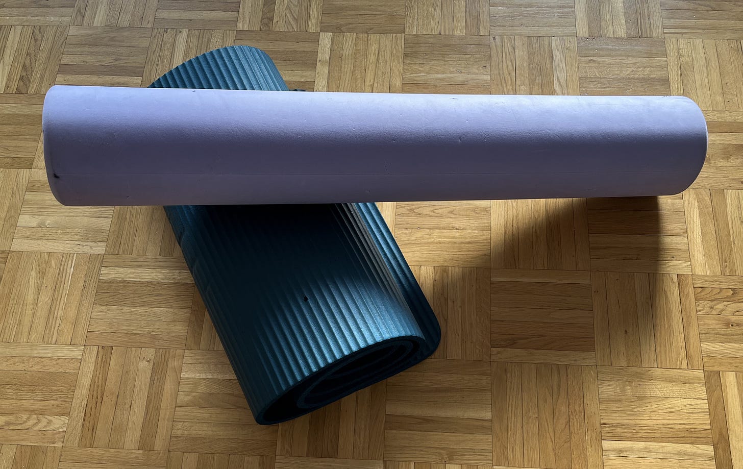 Yoga mat and foam roller home workout equipment for strength training and mobility work