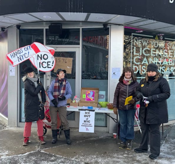 Image of four women in front of a table that has a sign that says "ICE Out of NYC" One woman is holding a sign that is shaped like a whistle. It is red and white and says "HANDS OFF NYC! NO ICE" Image of four women in front of a table that has a sign that says "ICE Out of NYC" One woman is holding a sign that is shaped like a whistle. It is red and white and says "HANDS OFF NYC! NO ICE"