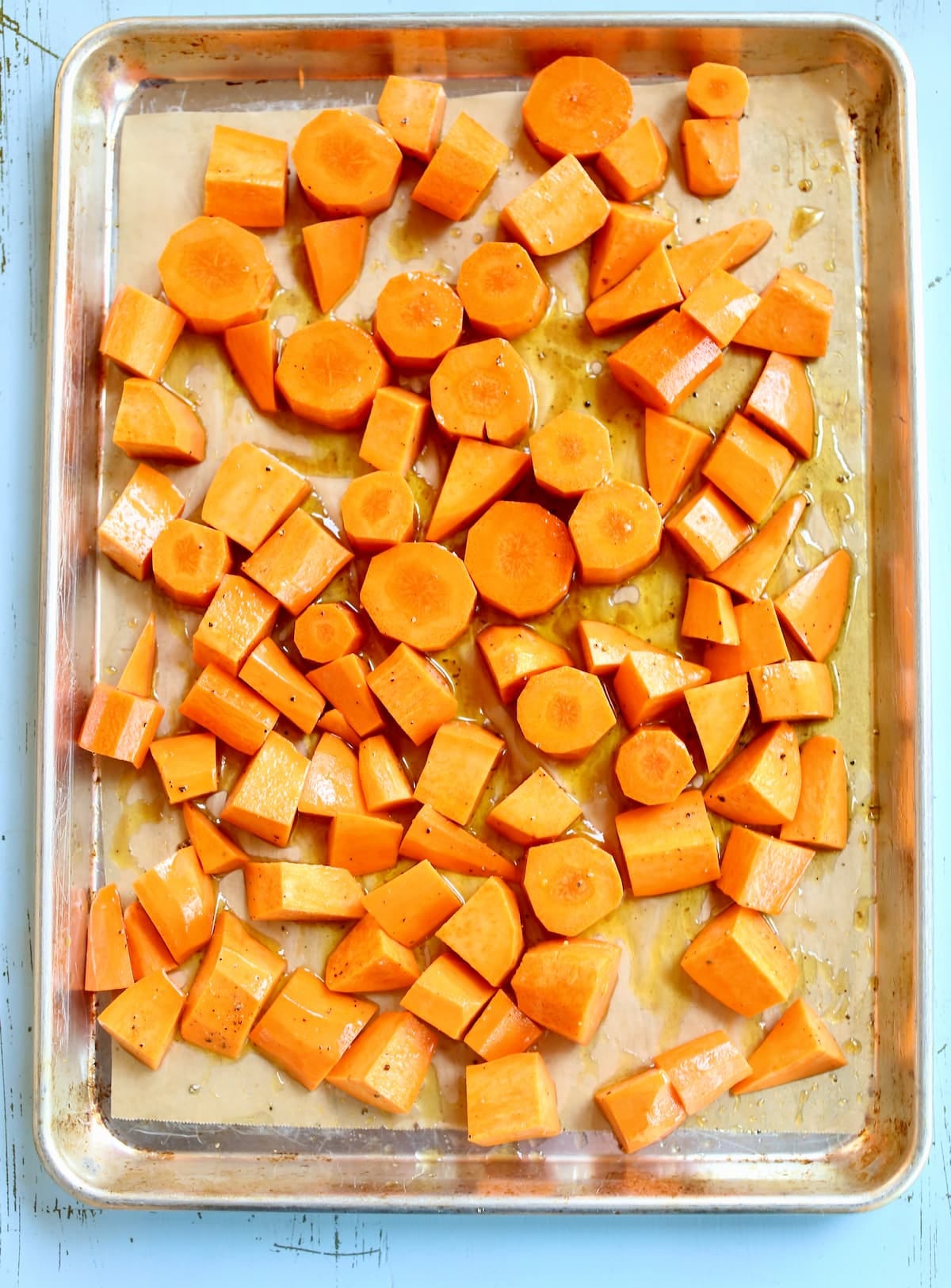 raw vegetables on a baking sheet pan.