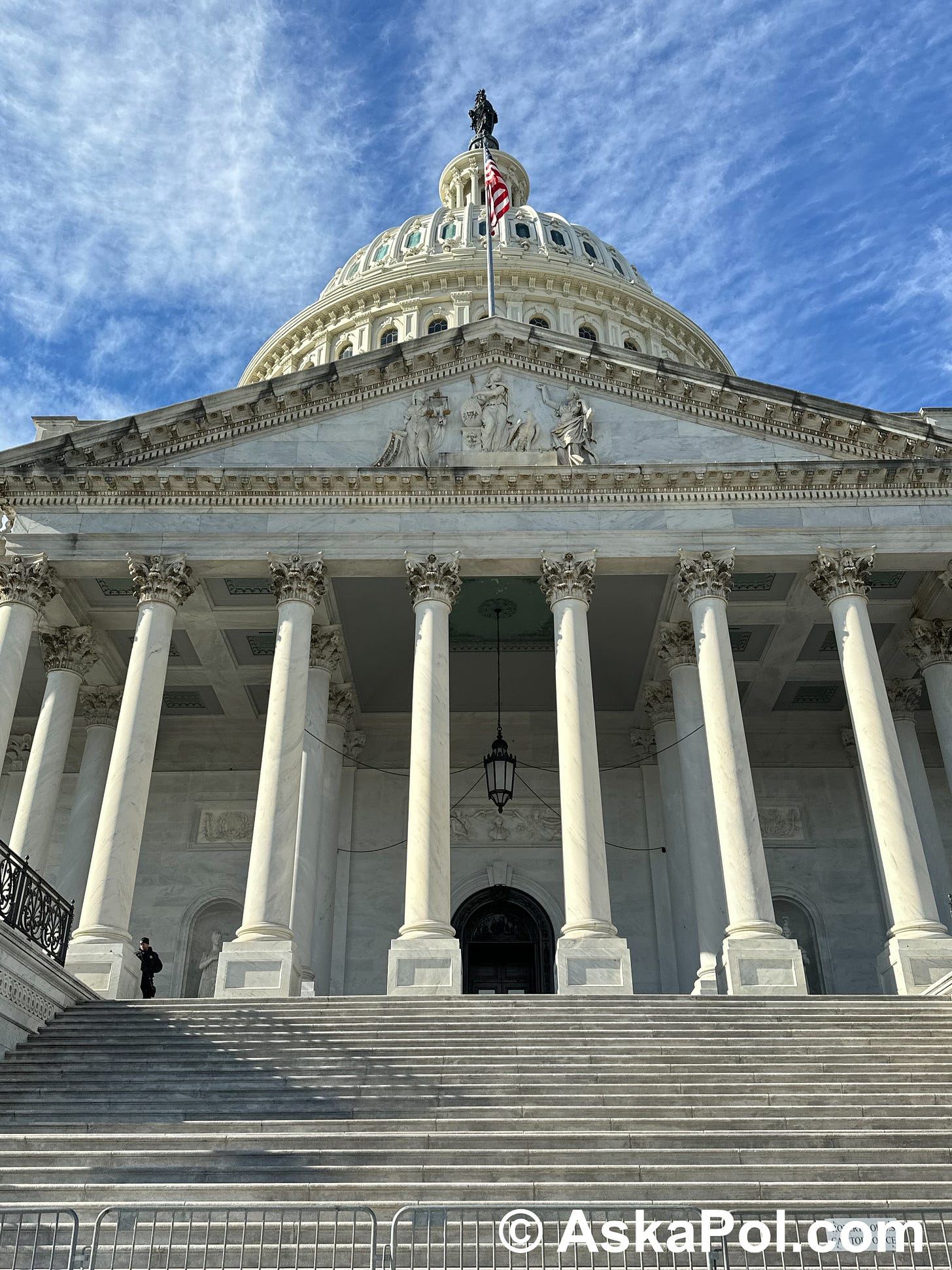 A flag on US Capitol rests on a windless day in Washington Photo: Matt Laslo © www.askapolcrypto.com