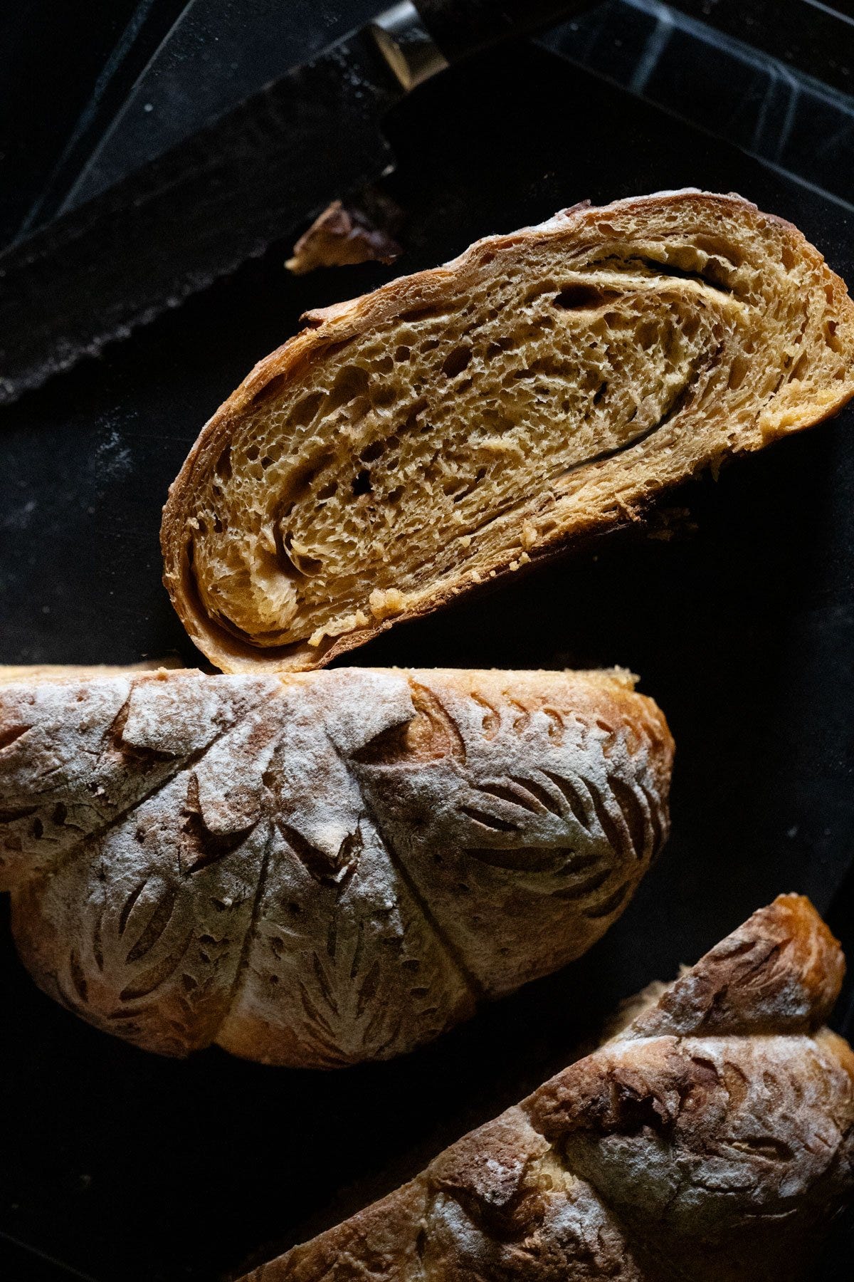 Pumpkin sourdough with a sugar cinnamon swirl sliced and showing the pumpkin shaping