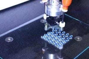 A lattice of active and passive filaments being printed via rotational multimaterial 3D printing.
