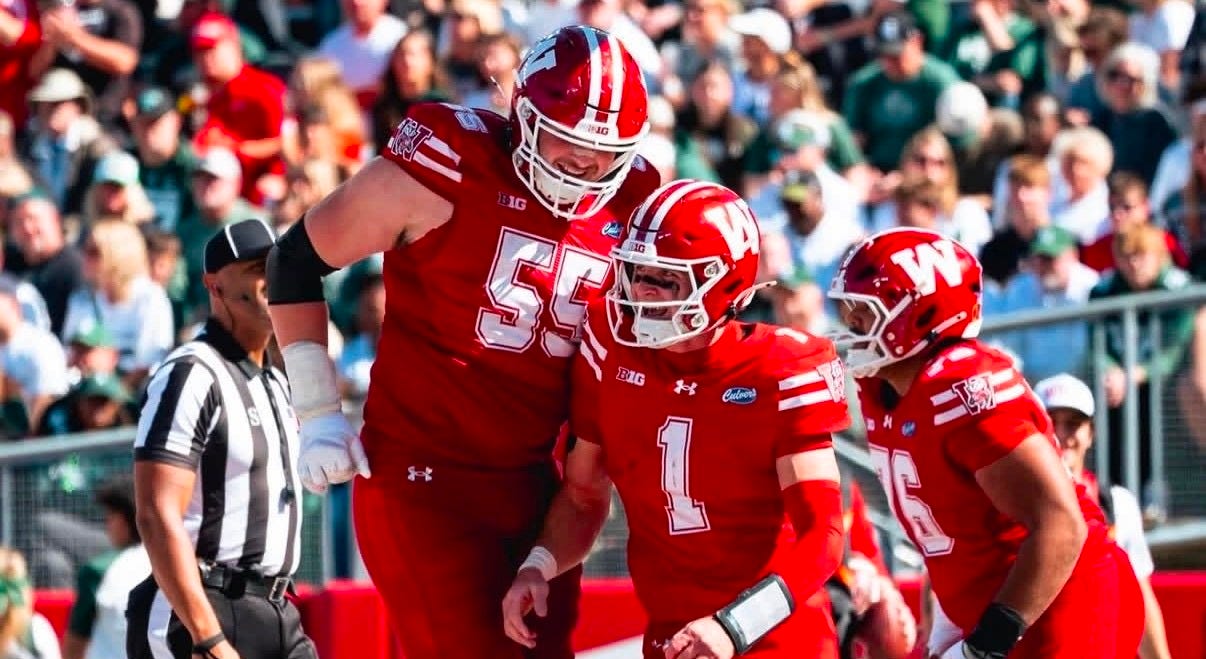 Wisconsin quarterback Colton Joseph celebrates with offensive lineman Kevin Heywood during the Michigan State game. Wisconsin quarterback Colton Joseph celebrates with offensive lineman Kevin Heywood during the Michigan State game.