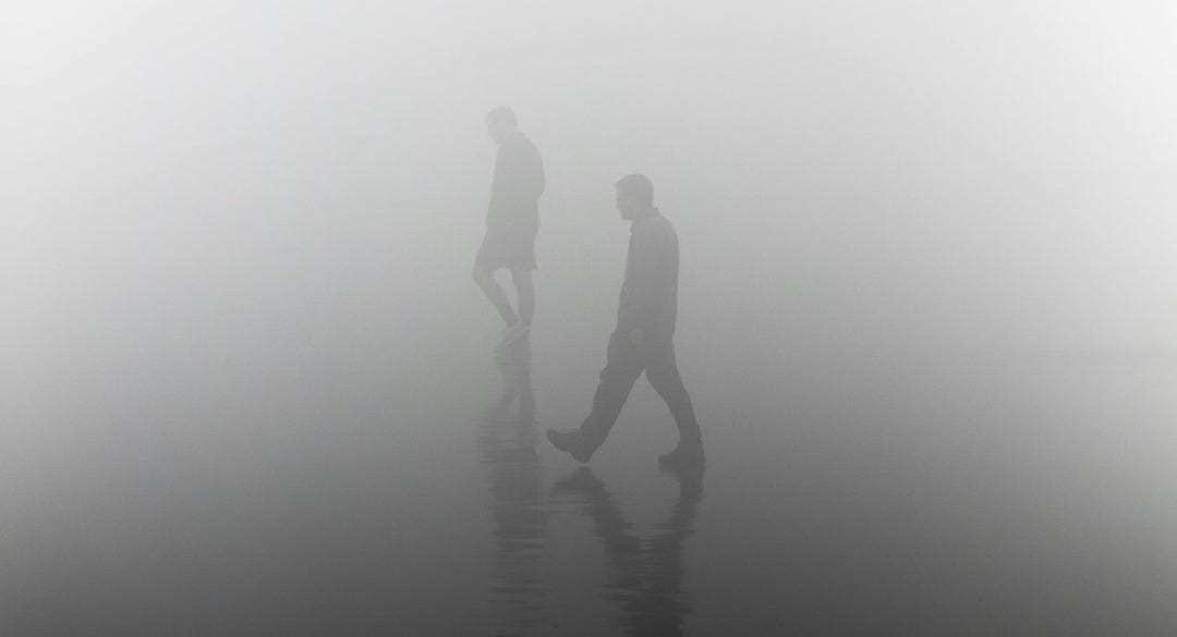silhouette of man during foggy day silhouette of man during foggy day