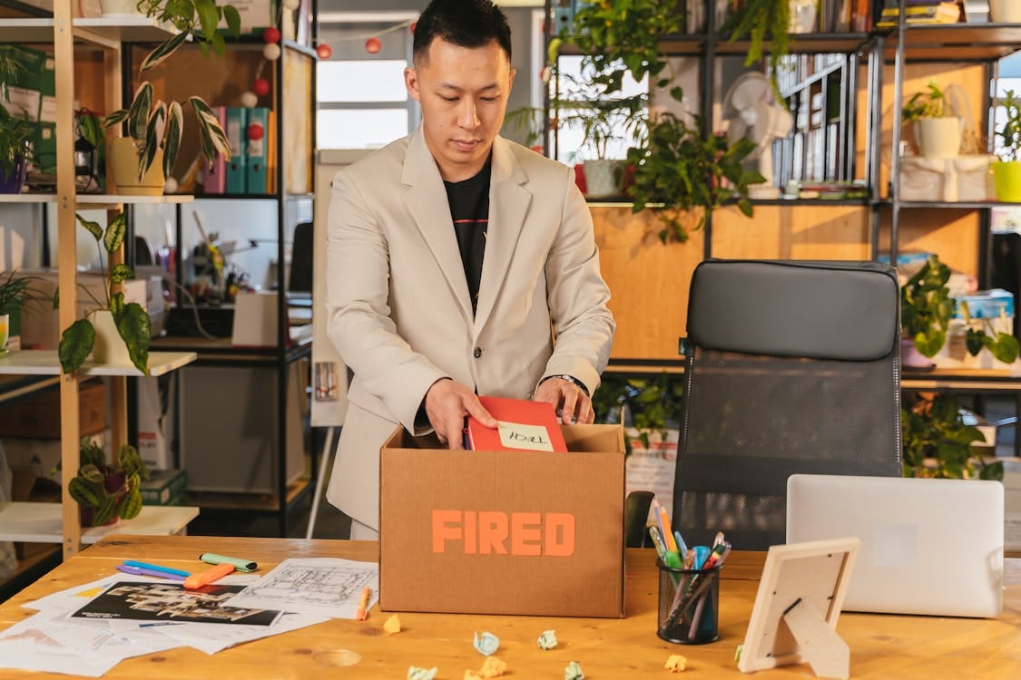 Man packing box after getting fired