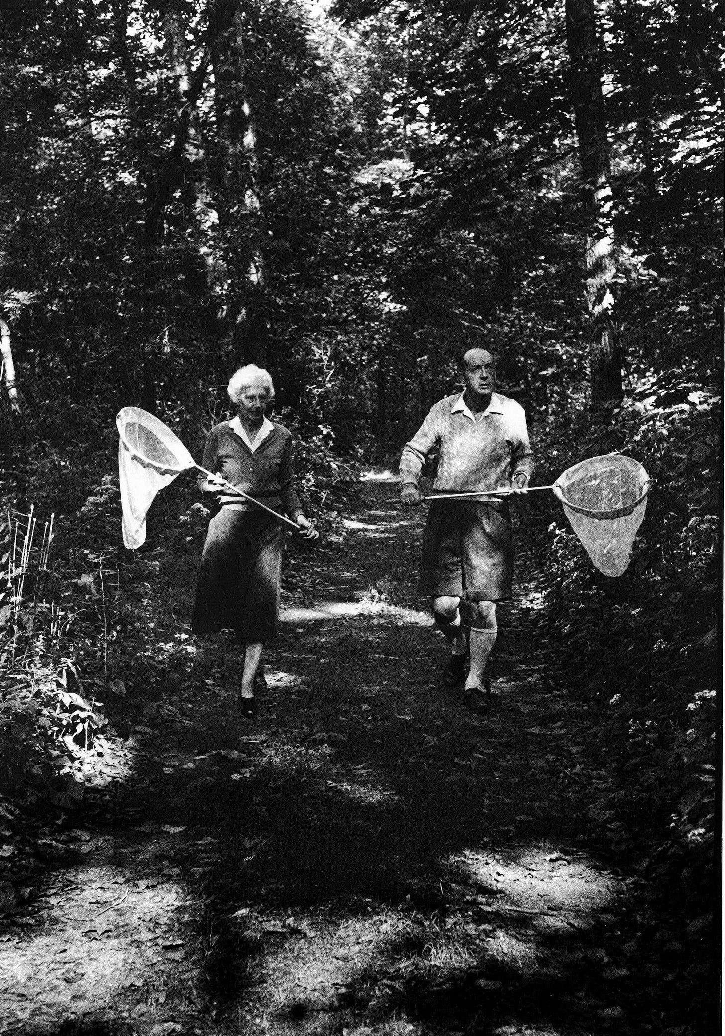 Renowned author Vladimir Nabokov and his wife Vera, sharing their passion for lepidoptery, chasing butterflies in 1958.