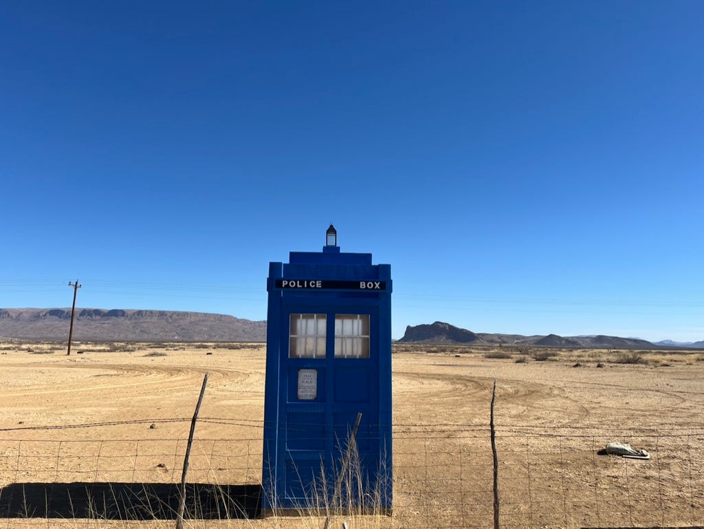 A blue box in a desert

Description automatically generated
