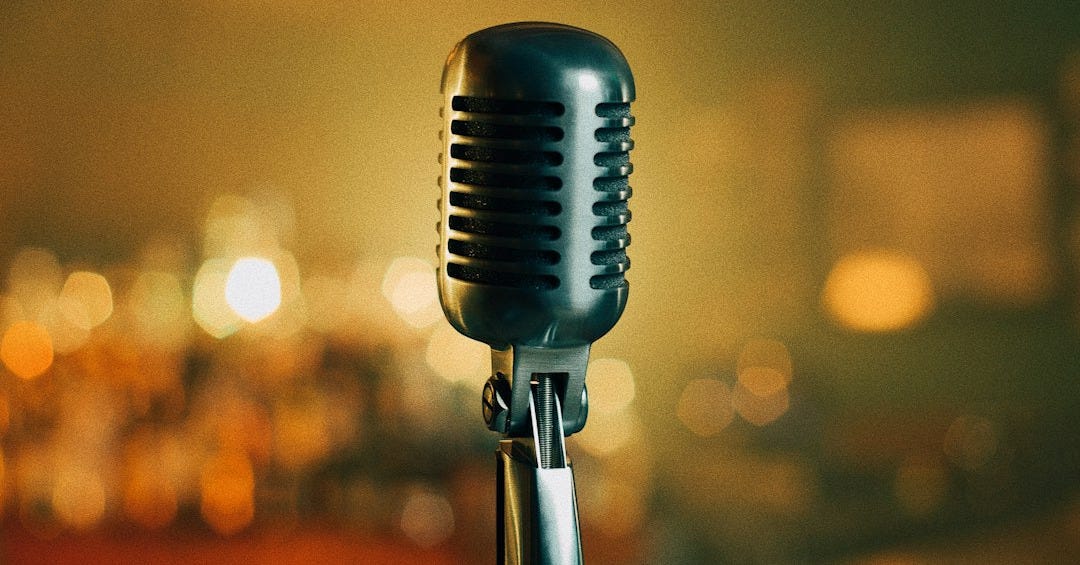 a black microphone with a blurry background