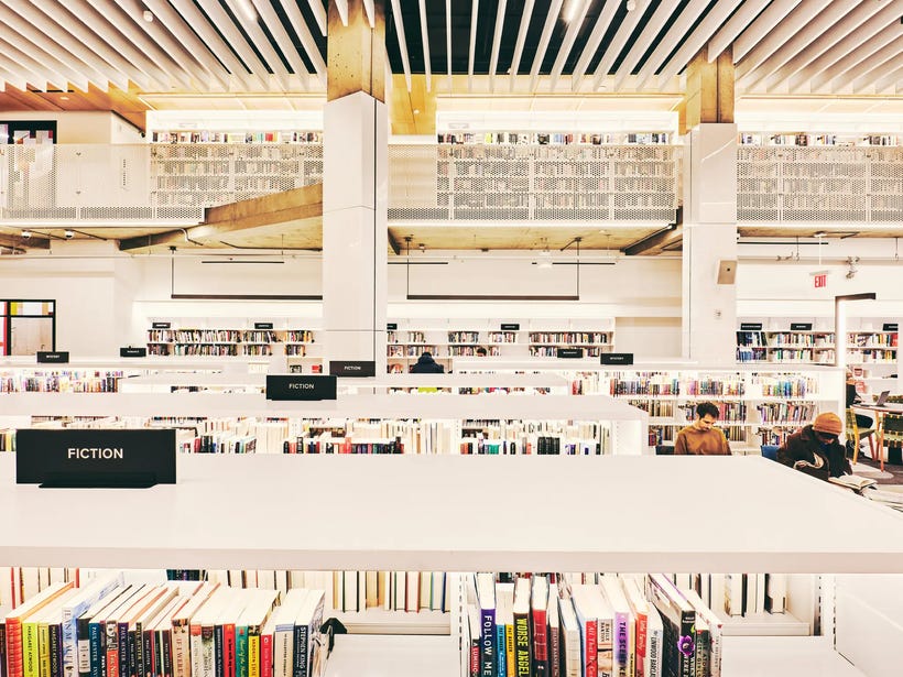A huge library full of books and bright light A huge library full of books and bright light