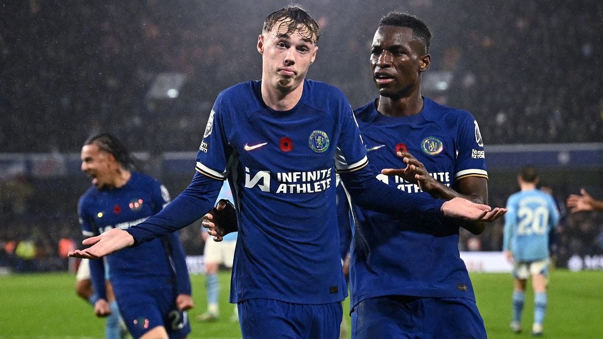 Manchester City draw 4-4 at Chelsea and move clear at the top