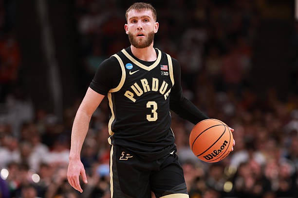 Braden Smith of the Purdue Boilermakers dribbles against the Arizona Wildcats during the first half of a game in the Elite Eight of the 2026 NCAA...