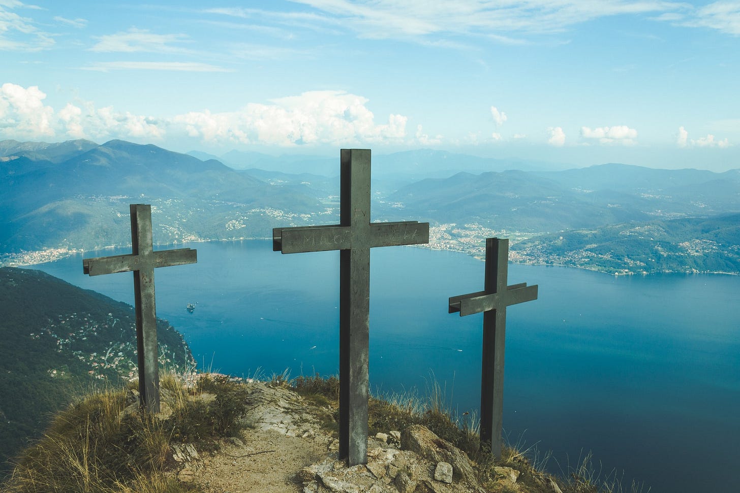 [Crosses - Photo by Federico Tasin on Unsplash]