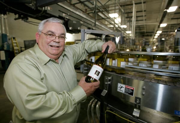 Fred Franzia in 2007 with a bottle of his inexpensive Charles Shaw wine. When asked how he could sell wine for less than a bottle of water, he replied, “They’re overcharging for the water — don’t you get it?”