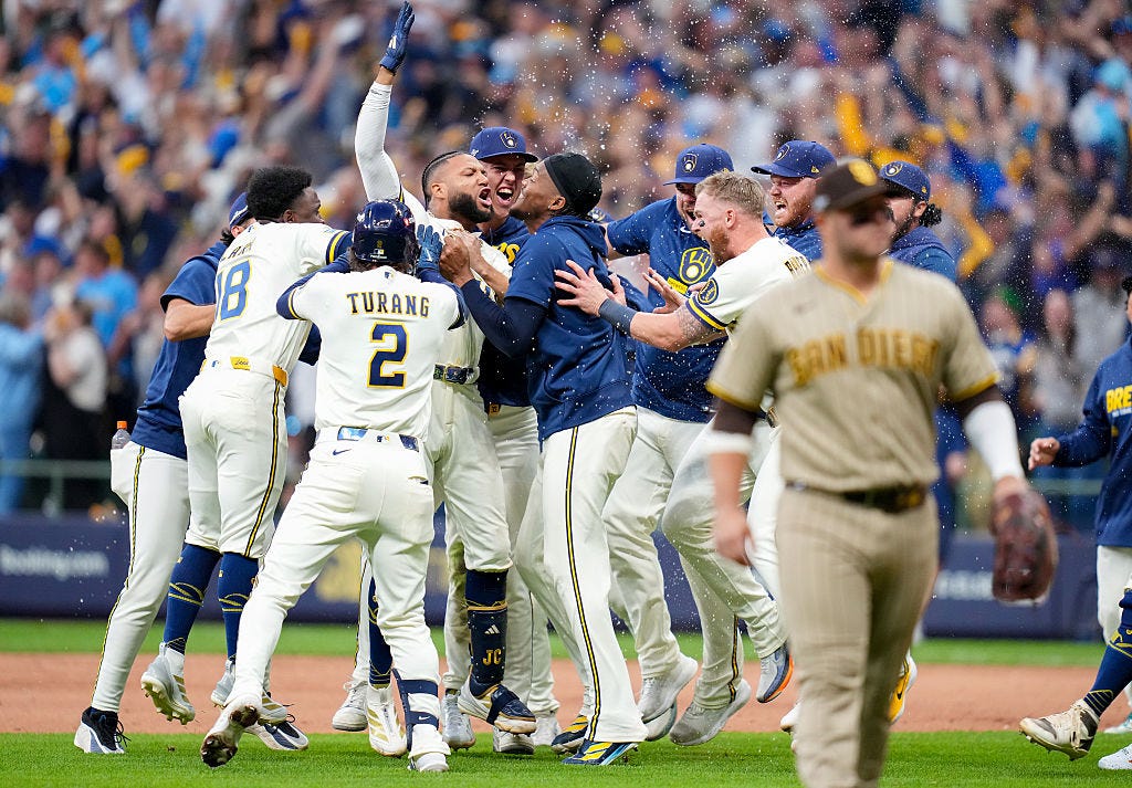 Jackson Chouri celebrates with his teammates, who are circling him. Jackson Chouri celebrates with his teammates, who are circling him.